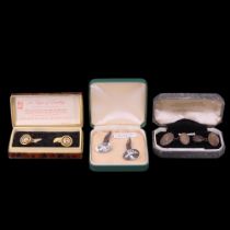 Two pairs of silver cufflinks together with a gold-plated pair in the form of ball bearings