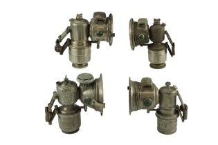 Four early 20th Century carbide bicycle lamps comprising "The Revenge", Vulture" and "Panther" by