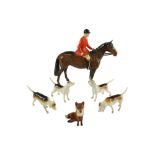 A Beswick huntsman together with a fox and four hounds, fox (a/f), tallest 21 cm