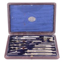 A cased set of A G Thornton draughtsman's drawing instruments, with two pens having ivory handles,