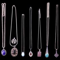 A large group of semi-precious gemstone pendants and neck chains, including amethyst, rose quartz,