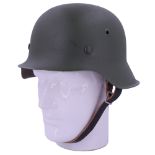 A German Third Reich steel helmet, re-painted and re-lined