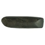 A Neolithic Langdale type semi-polished stone axehead, 15 cm