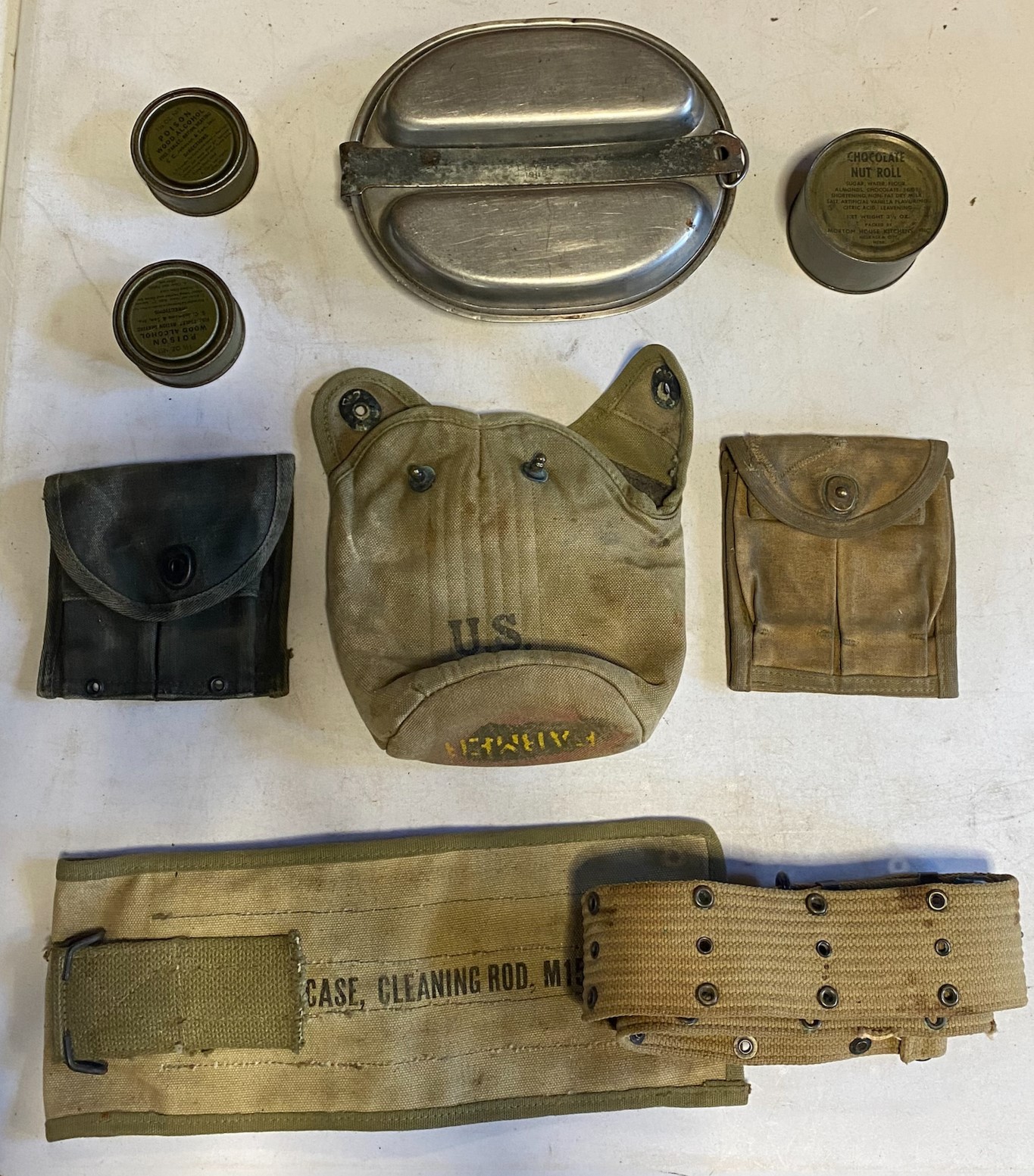 A set of Second World War US Army meat cans, 1945 dated, together with a water bottle pouch,
