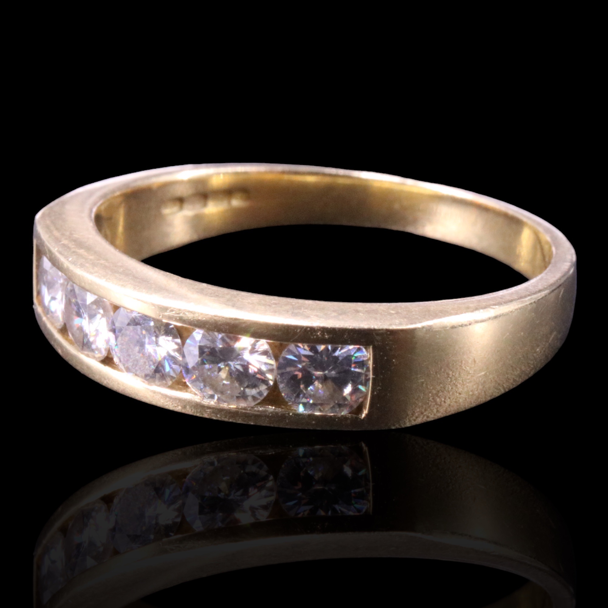 A five-stone diamond band, comprising five brilliant-cut stones of approx 0.9 cts aggregate weight