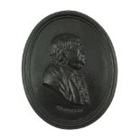 A late 18th / early 19th Century Leeds Pottery black basalt relief portrait plaque of Benjamin