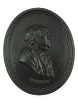 A late 18th / early 19th Century Leeds Pottery black basalt relief portrait plaque of Benjamin