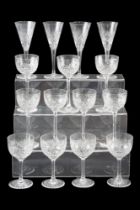 A suite of crystal glasses including seven large wines, eight medium wines, etc