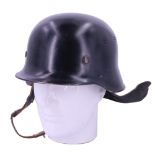 A German Model 1935 fire service aluminium helmet with leather neck guard