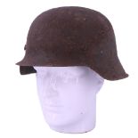 A German Third Reich steel helmet, re-painted and re-lined