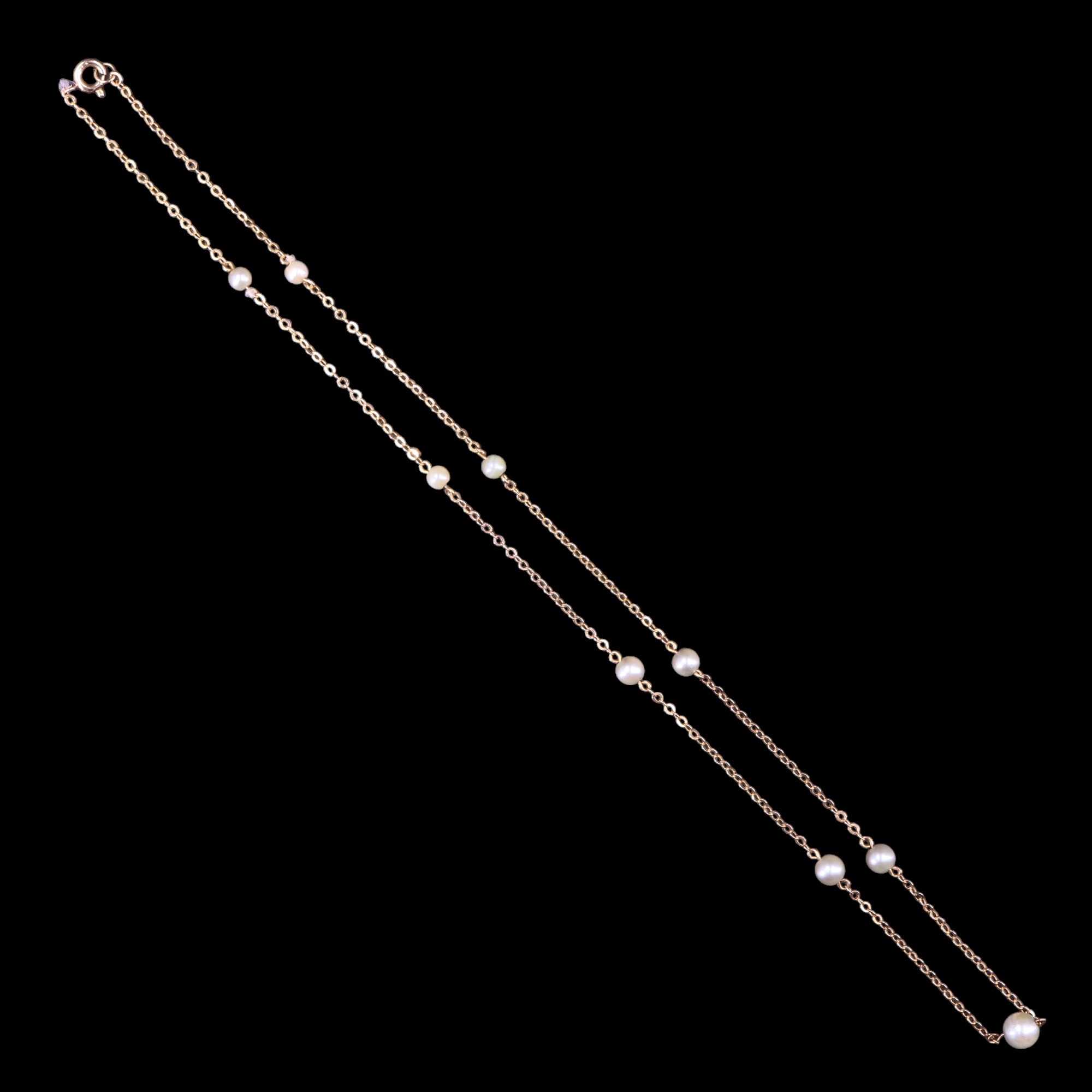 A pearl and 9 ct yellow metal necklace, being a fine belcher link neck chain interspersed with