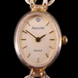 A lady's 2003 Accurist "Gold" 9 ct gold dress wristwatch, having a quartz movement and oval face set