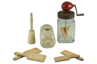 A 1950s Blow butter churn together with butter parts, a potato pounder and a stoneware hot water