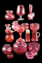 A quantity of cranberry glass including bowls, vases etc, tallest 17 cm
