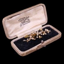 A Victorian / early 20th Century seed pearl set 9 ct gold brooch, in the form of a swallow in flight