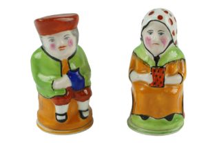 Early 20th Century Crown Staffordshire Pottery figural salt and pepper pots, modelled as a man and a