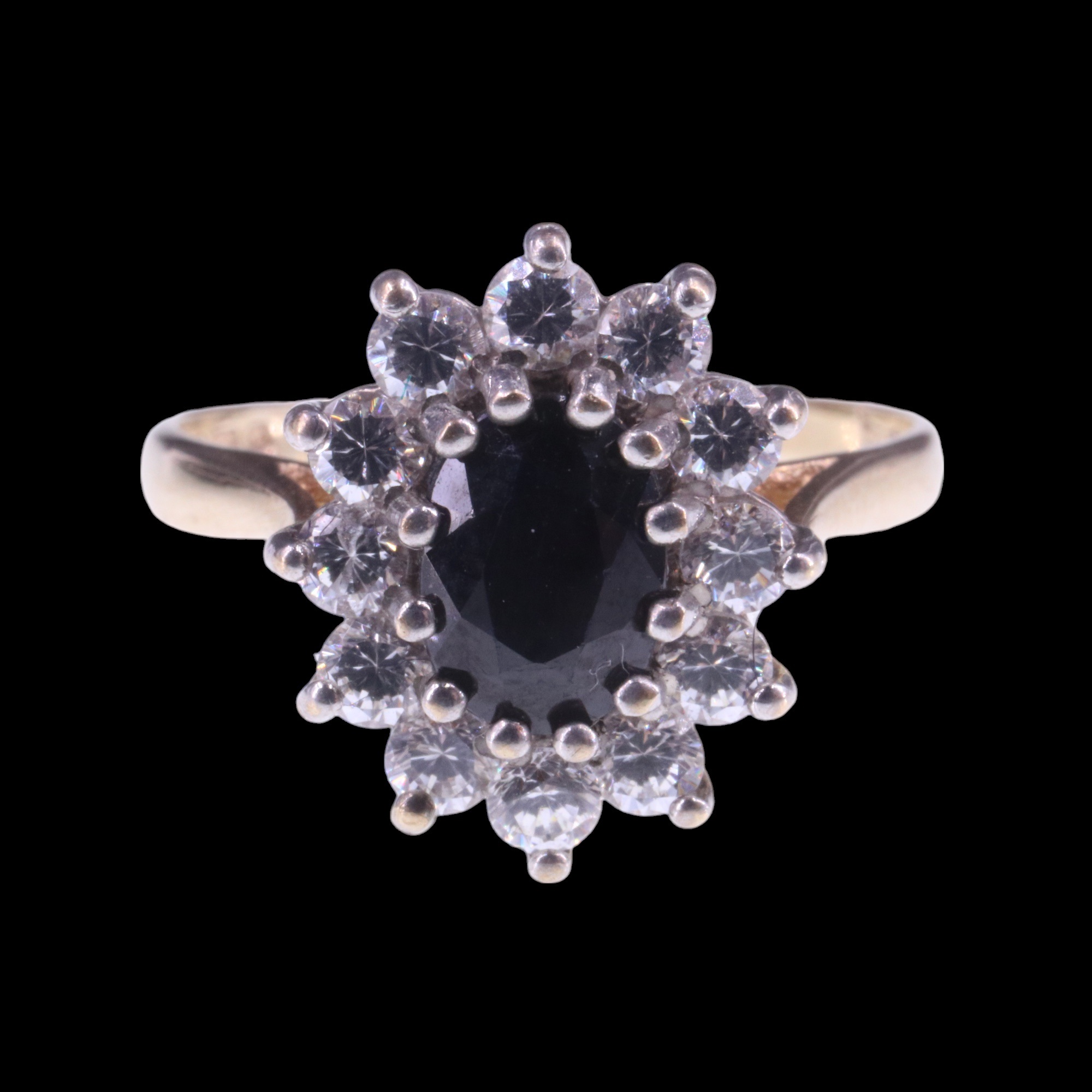 A 1980s sapphire and white stone cluster ring, the central oval-cut sapphire of approx 1 ct, claw- - Image 2 of 6