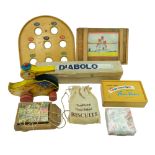 A group of vintage wooden toys including a Diabolo in original carton by W L & S Ltd, a pull-along