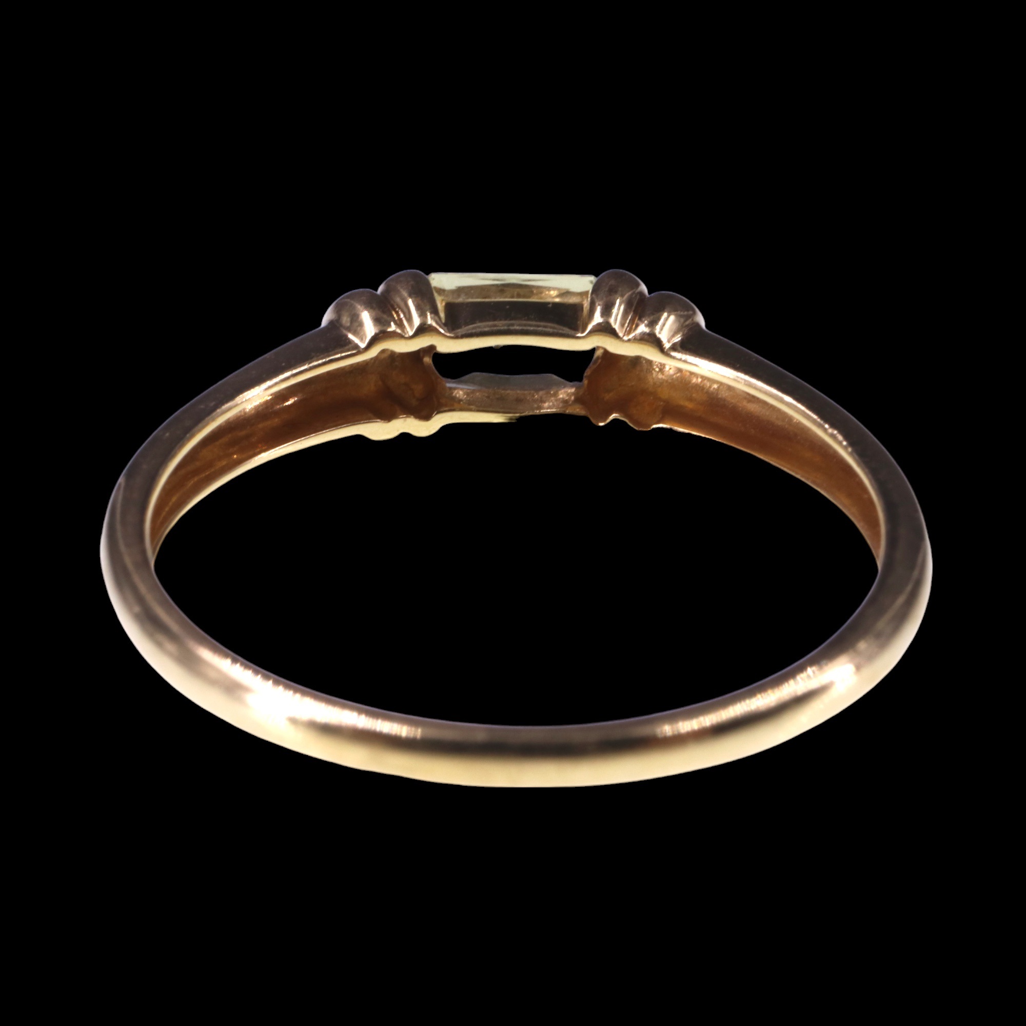 A pale yellow topaz finger ring, the emerald cut stone clinched between paired collars on an 18 ct - Image 3 of 4