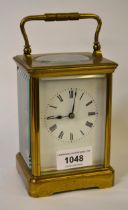 French gilt brass carriage clock, the enamel dial with Roman numerals, with a two train movement