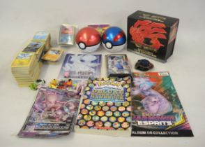 Quantity of Pokemon cards and toys including sealed Fates Collide, Pokeballs etc.