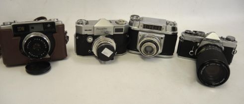 Quantity of 35mm cameras with lenses including a Braun Paxette Reflex and an Olympus OM-1N