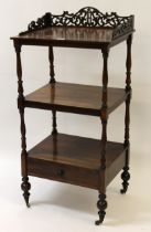 19th Century rosewood three tier whatnot, the pierced galleried top with turned supports and