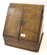 Victorian figured walnut slope front stationery cabinet, with two doors enclosing fitted interior,
