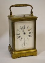 Brass cased carriage clock with enamel dial, hour repeat and alarm functions No key. Balance wheel