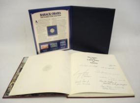Danbury Mint ' Barack Obama ' presentation coin / stamp album, together with one volume of ' The