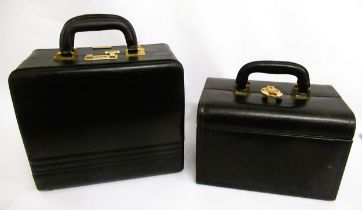 Juin Petite, black leather vanity case with combination lock, together with another black leather