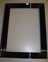 Modern ebonised moulded rectangular picture frame aperture, 48 x 69cm, together with two modern