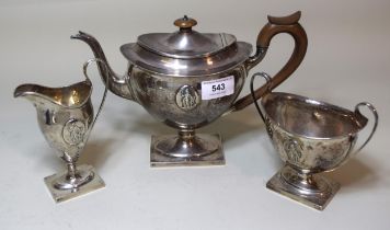 Early 20th Century Sheffield silver three piece tea service of oval pedestal design in George III