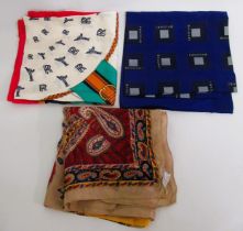 Three various silk scarves by Bulgari, Oscar de la Renta and Rolls Royce