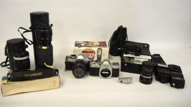 Canon AE1 camera and a Canon AV1 camera with lenses and accessories