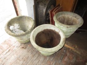 Set of three modern cast concrete garden planters