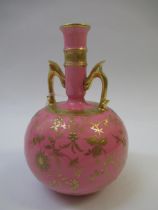 Late 19th Century Mintons two handled bottle shaped vase with gilded floral decoration on a pink