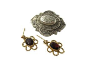 Pair of 9ct gold and garnet earrings, together with a Victorian white metal brooch