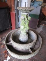 Circular weathered cast concrete garden fountain with central standing figure, 78 x 93cm