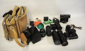 Russian Zenit camera, together with a quantity of various lenses including Takumar, Vivitar and