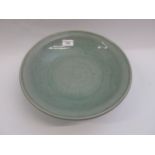Chinese Celadon circular deep dish with shallow incised decoration, 32cm diameter, with a hardwood