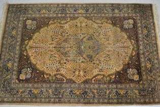 Indo Persian rug with a medallion and all-over design on a beige ground with borders, 200 x 141cm