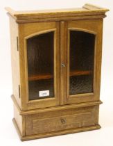 Small oak hanging cabinet with glazed doors above a single drawer, 35 x 48cm This item is in