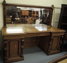 Large Victorian oak twin pedestal sideboard, the carved and moulded mirror back above an inverted