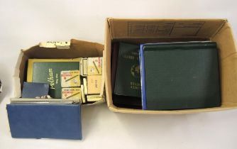 Two boxes containing a collection of World stamps including a small quantity of loose leaves, albums