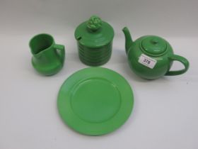 Ashtead potters green glazed teapot, plate, preserve jar and a jug