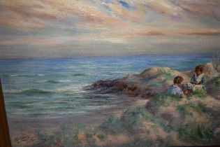 John C. Gray signed oil on canvas, coastal landscape with two children on a grassy beach, 25 x 35cm
