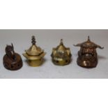 Group of four Asian bells, including a bronze rabbit, dog of foe etc.
