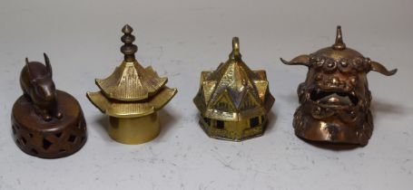 Group of four Asian bells, including a bronze rabbit, dog of foe etc.