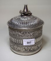 Indo Persian white metal floral decorated and embossed circular box with cover, having inscription